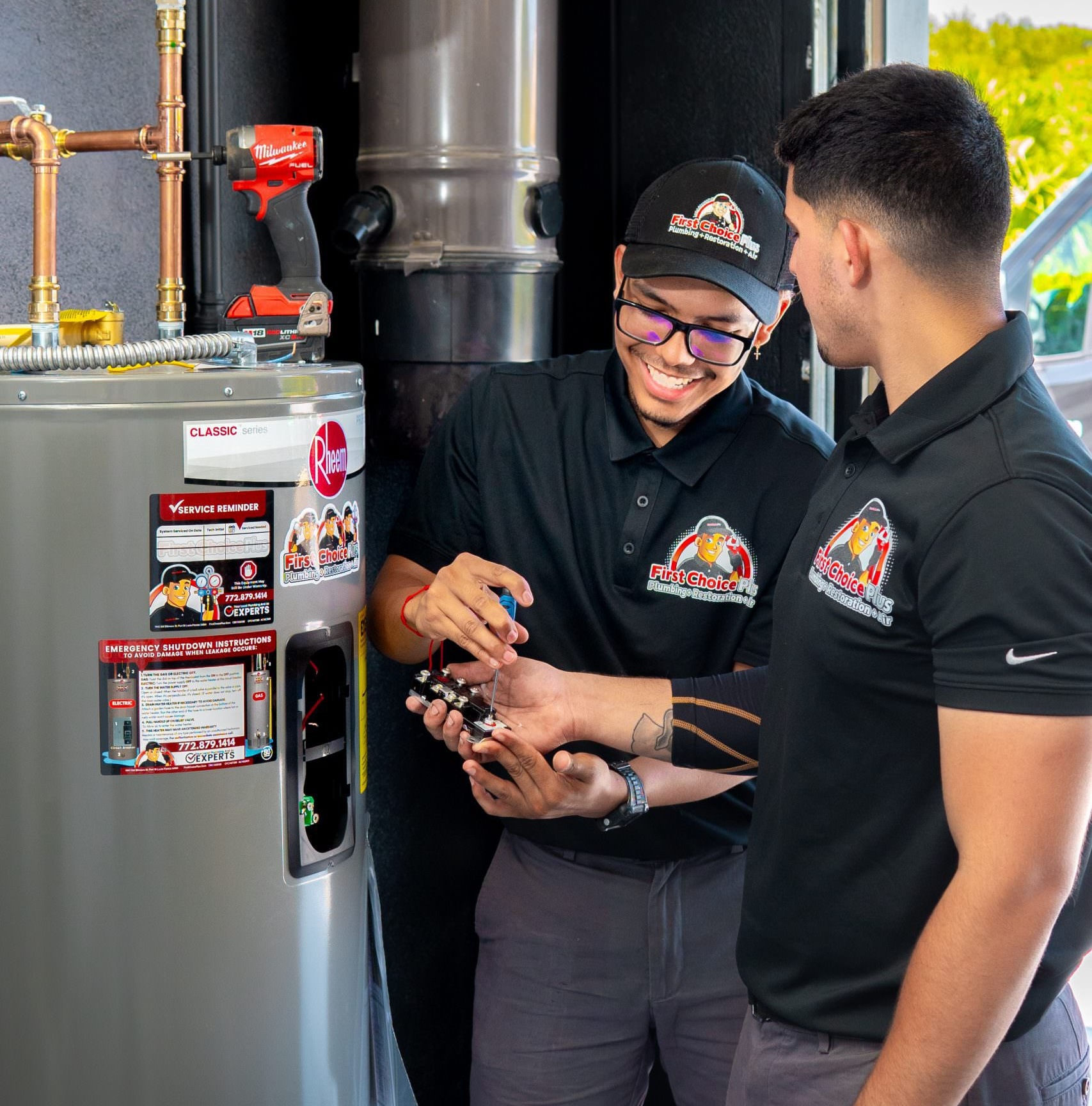 Two First Choice Team Members Fixing a Water Heater