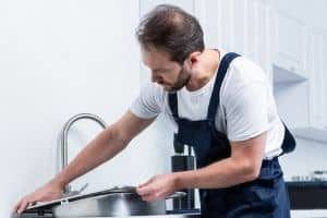 plumber installing new sink