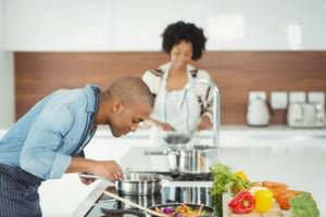 couple cooking in kitchen