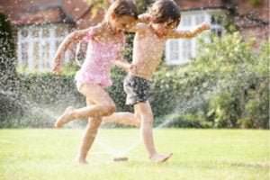 jumping through sprinklers
