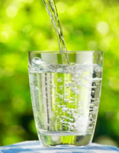 pouring water into glass