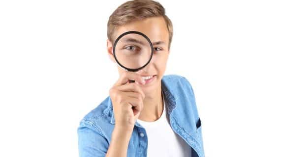 person with magnifying glass
